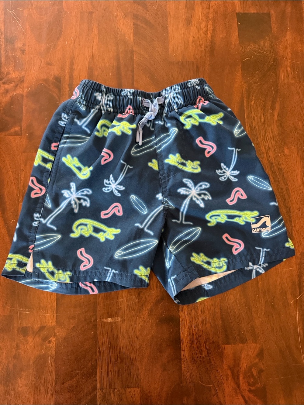 surf style Navy Swim Trunks with Neon Green, Pink and White Surf Prints